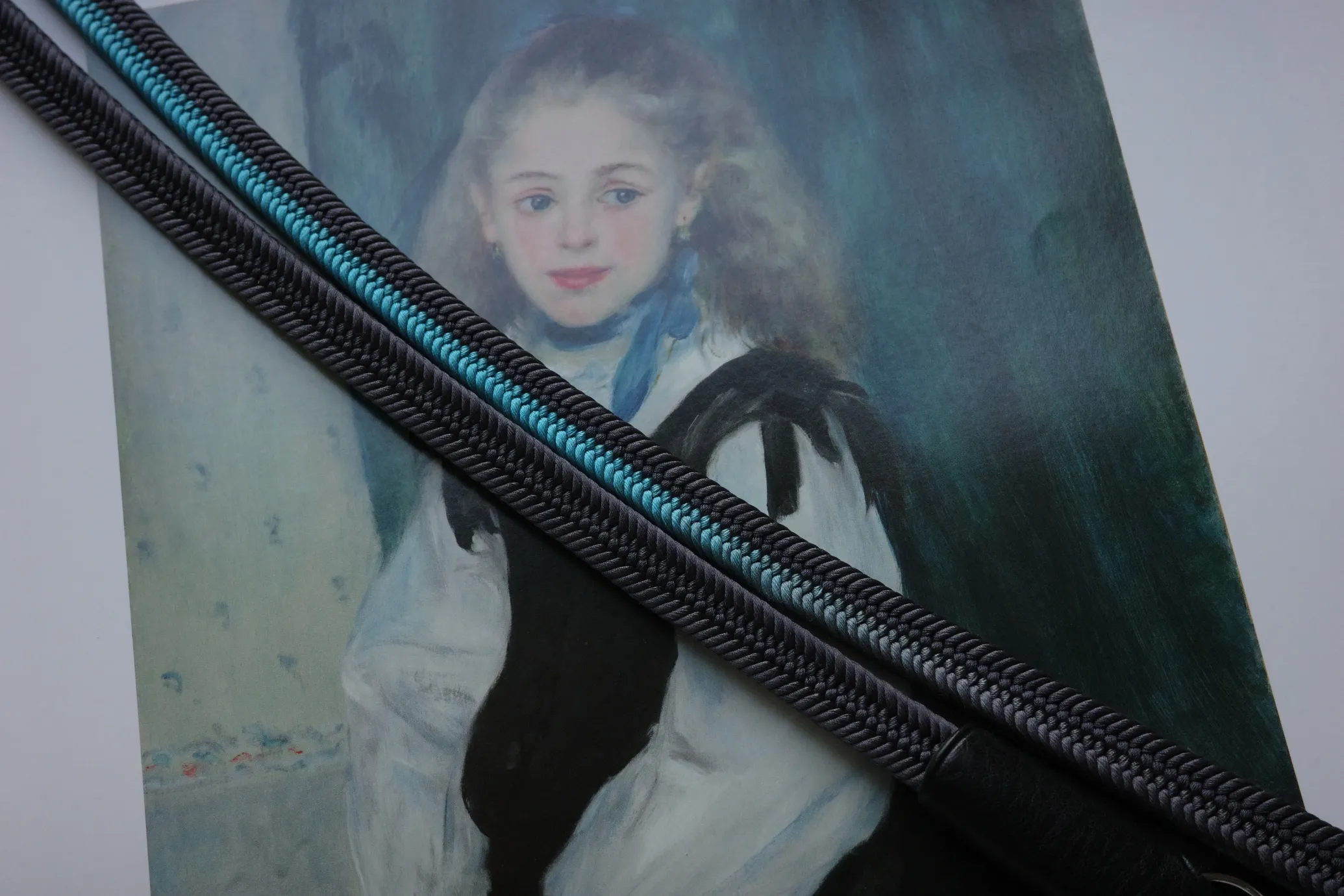 Crown Lividity Blue is a handmade camera neck strap made with Japanese kumihimo silk and genuine leather. Comfortable, durable, and ideal for premium cameras.