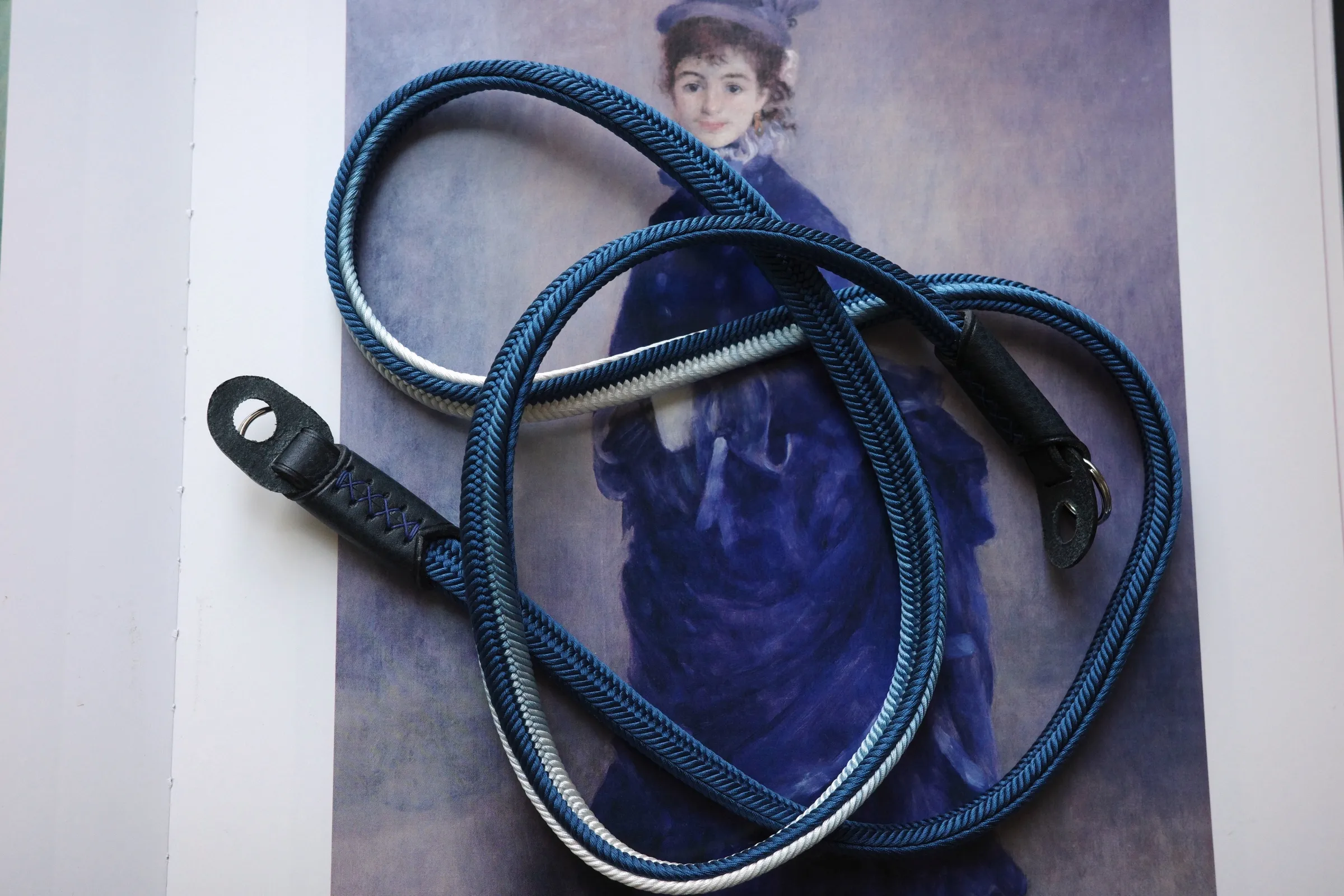 Crown Royal Blue is a handmade camera neck strap made with Japanese kumihimo silk and genuine leather. Comfortable, durable, and ideal for premium cameras.