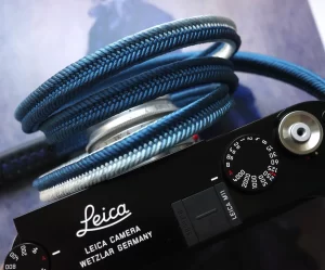 Crown Royal Blue is a handmade camera neck strap made with Japanese kumihimo silk and genuine leather. Comfortable, durable, and ideal for premium cameras.