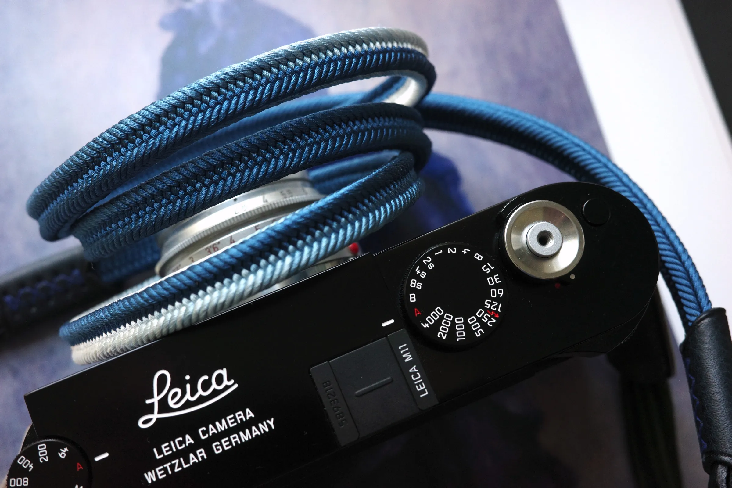 Crown Royal Blue is a handmade camera neck strap made with Japanese kumihimo silk and genuine leather. Comfortable, durable, and ideal for premium cameras.