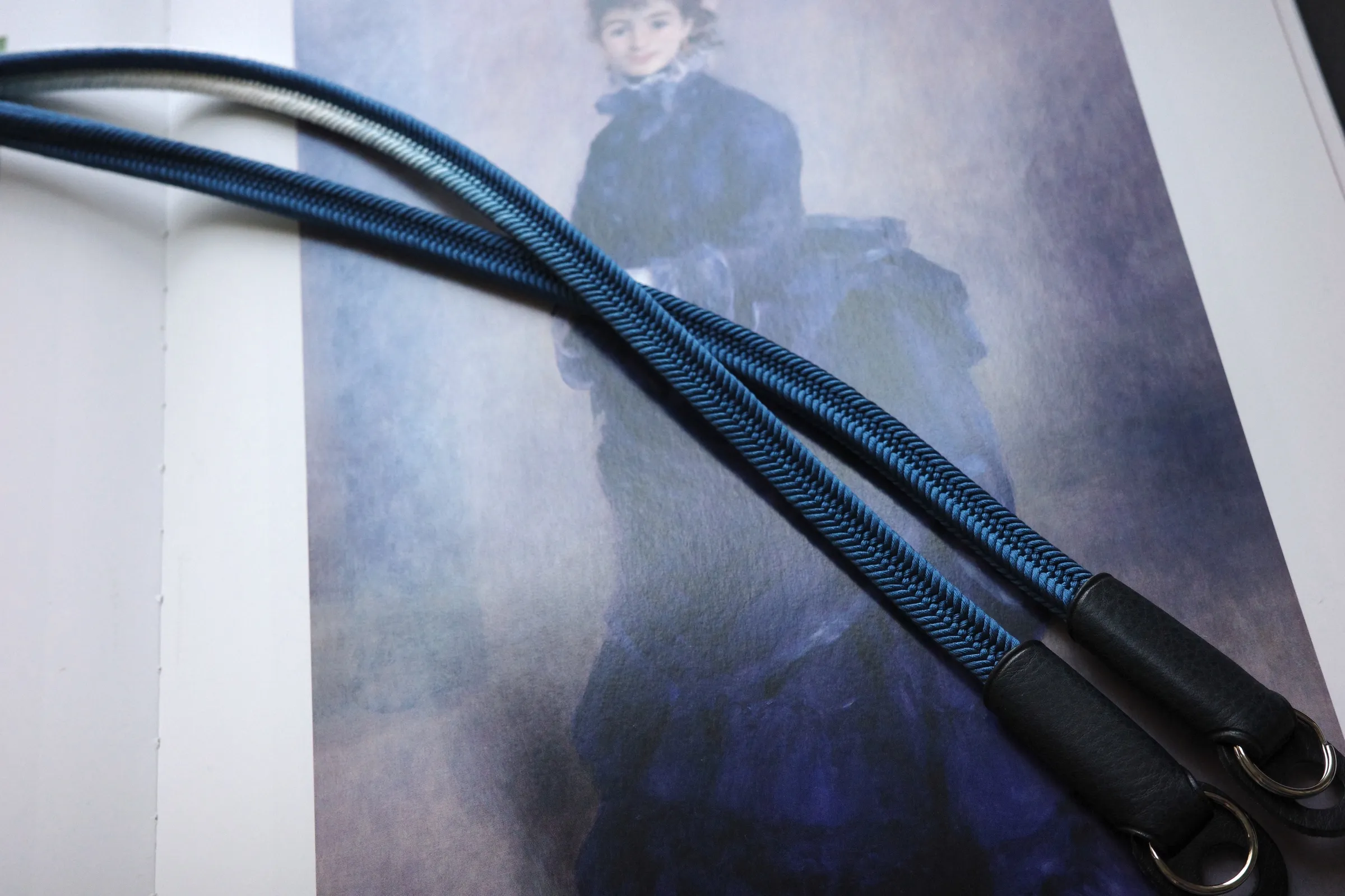 Crown Royal Blue is a handmade camera neck strap made with Japanese kumihimo silk and genuine leather. Comfortable, durable, and ideal for premium cameras.